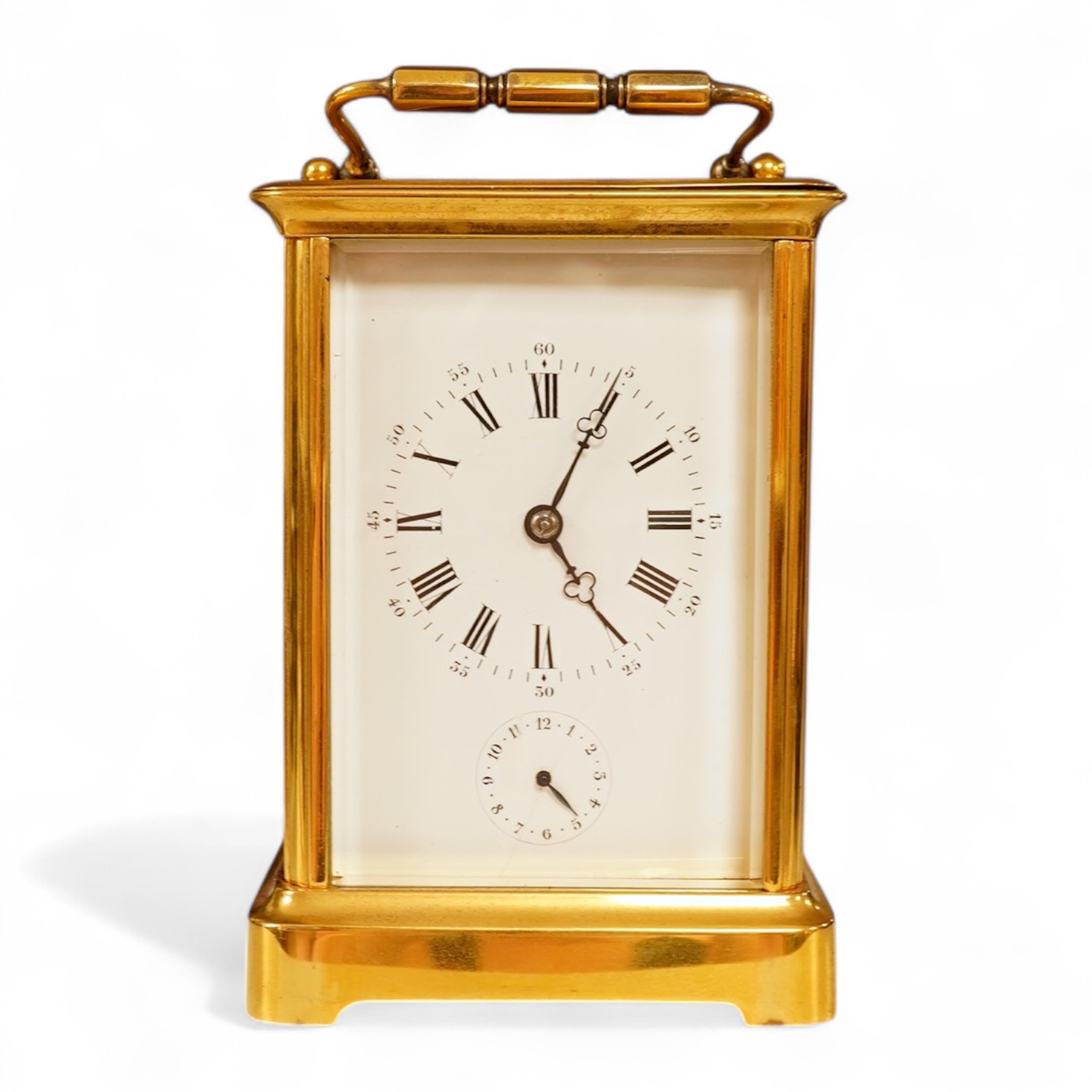 A French carriage clock with alarm, gong-striking movement, in a contemporary leather case, 17cm high